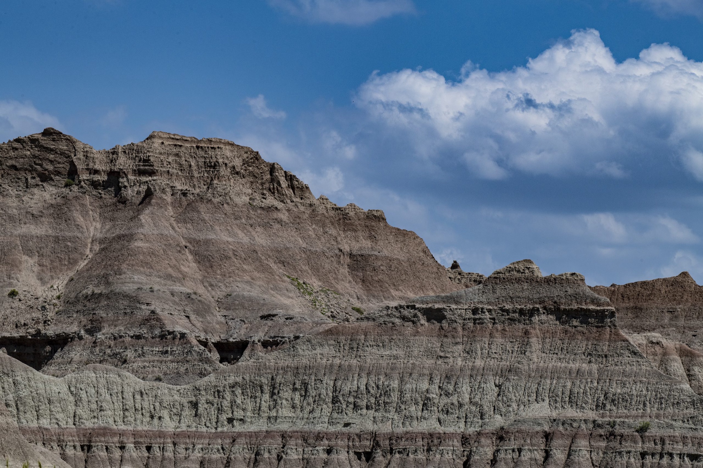 Badlands buttes under a cloudy sky