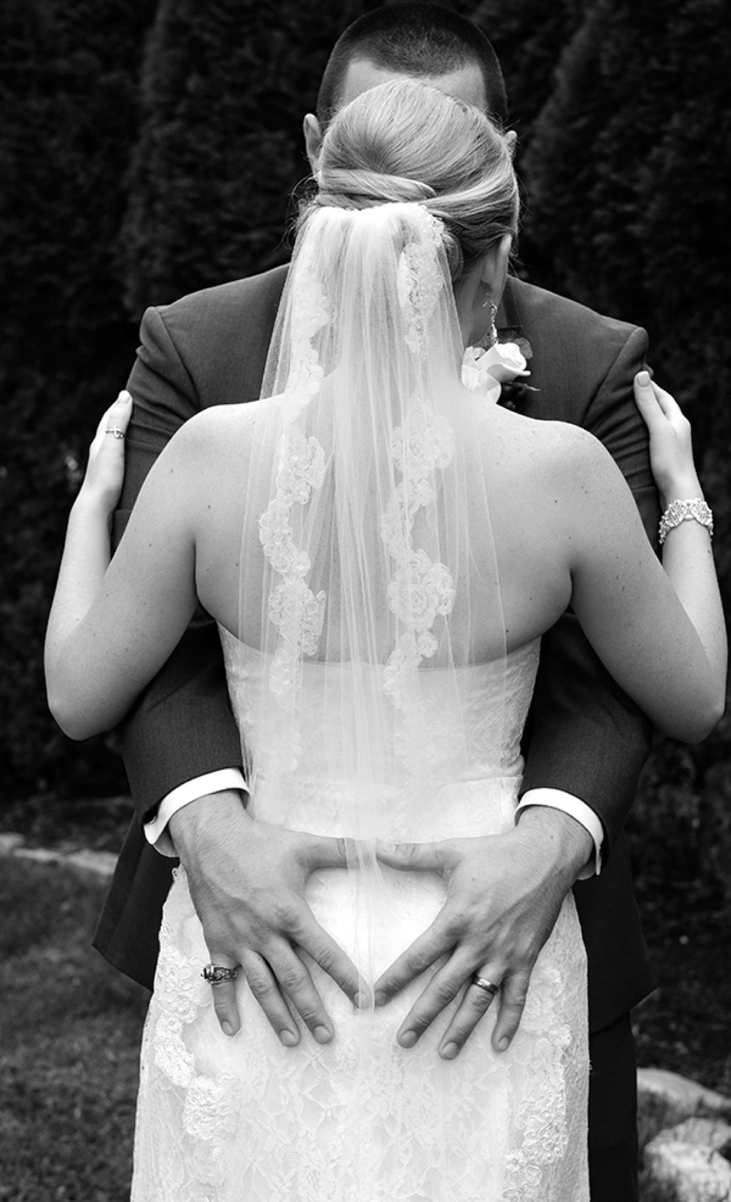 Bride's back in a lace gown