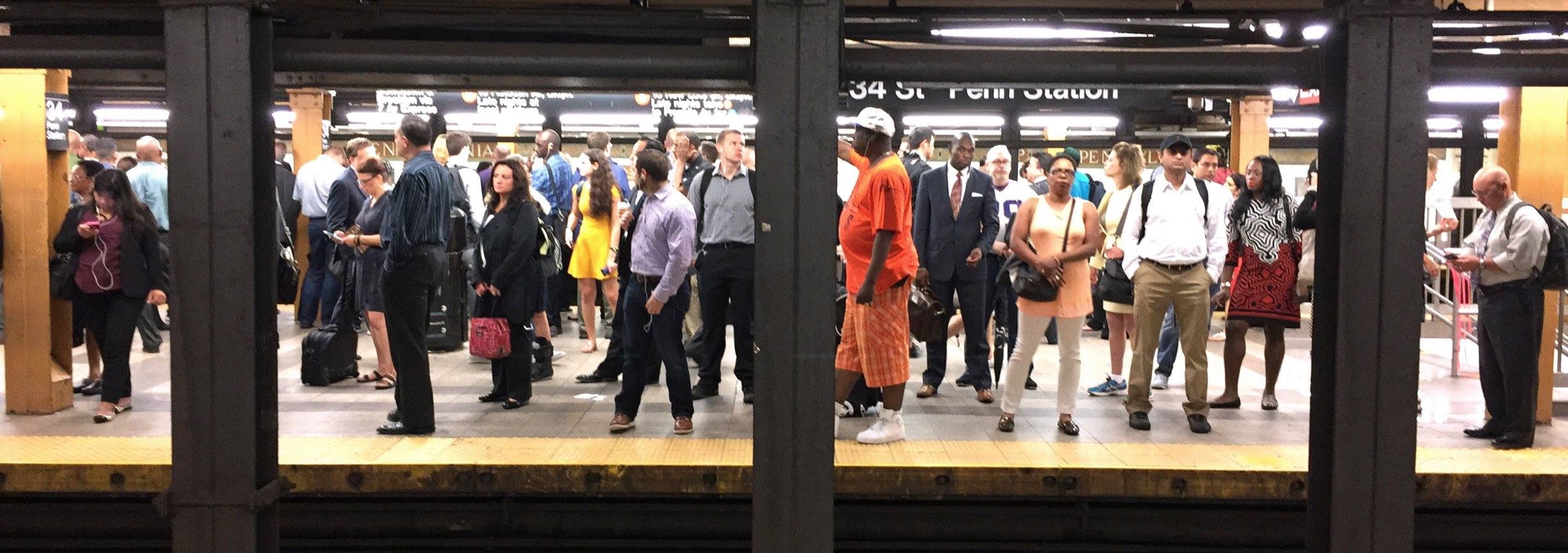 Commuters on a subway platform