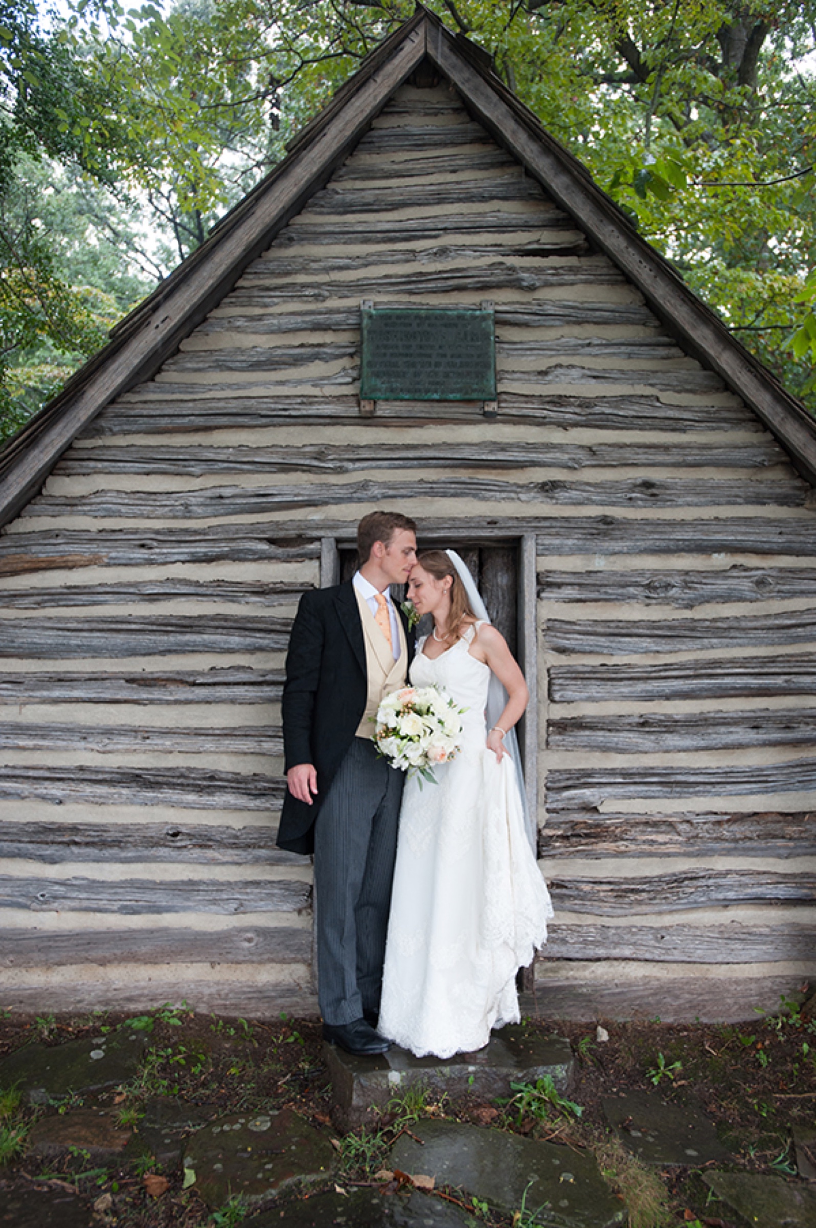 Couple at a log cabin door