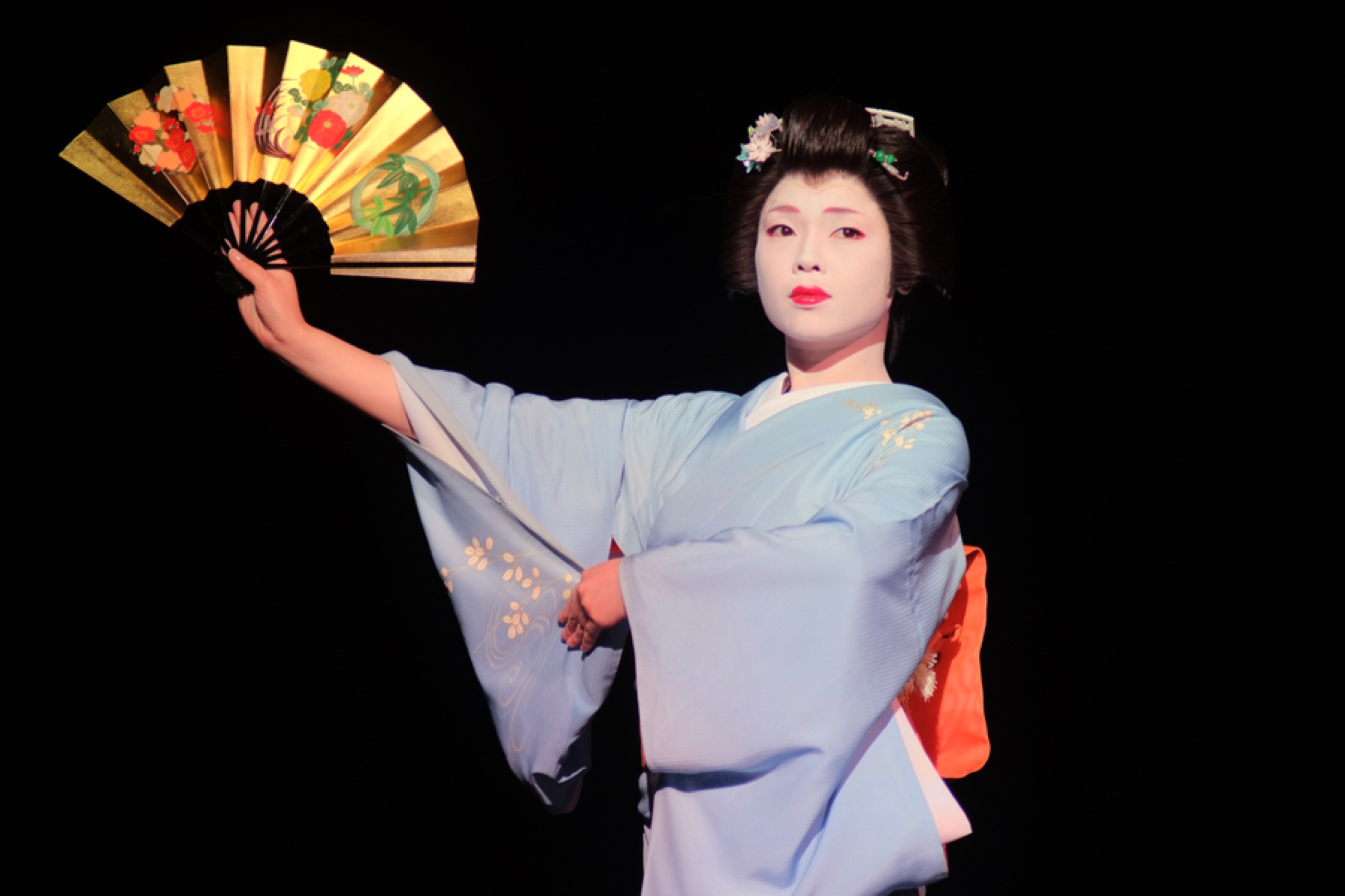 Dancer in a kimono with a fan